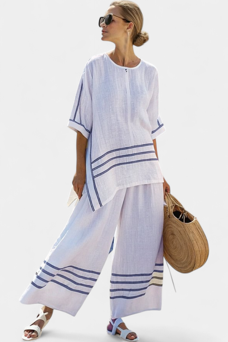 Rina – Sophisticated Asymmetric Striped Top and Bold Pants