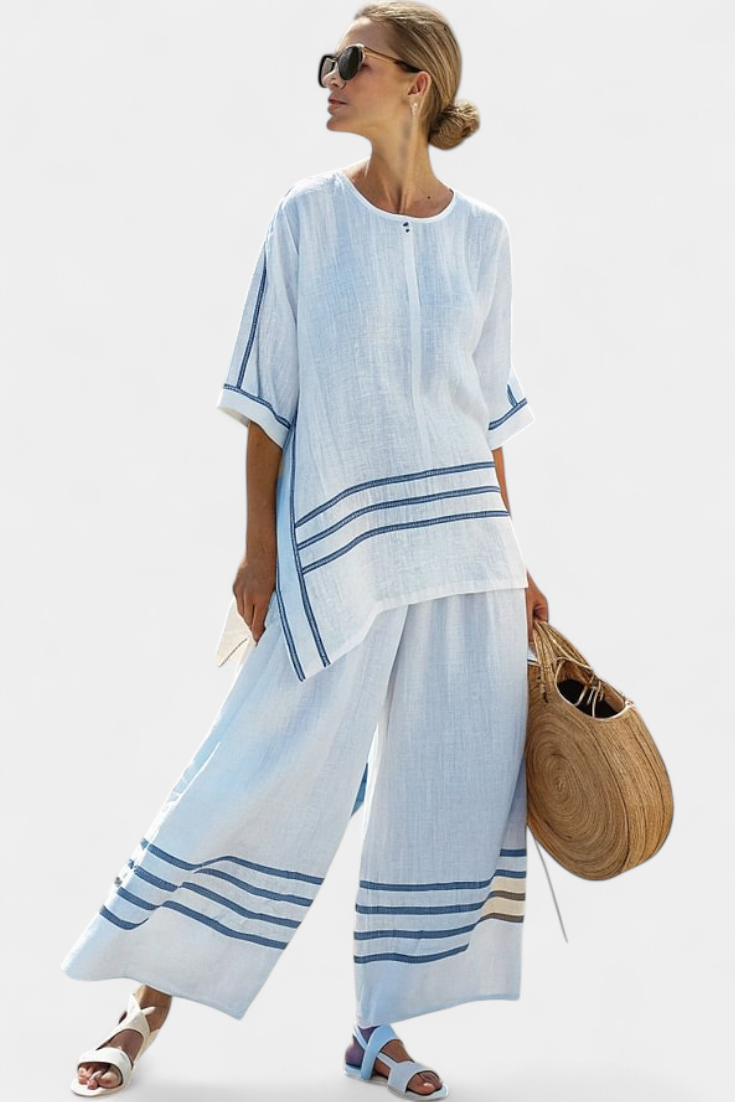 Rina – Sophisticated Asymmetric Striped Top and Bold Pants