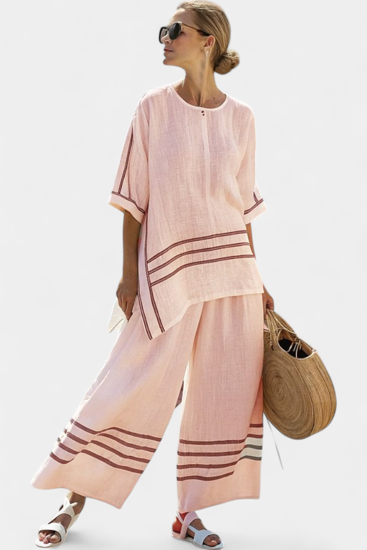 Rina – Sophisticated Asymmetric Striped Top and Bold Pants