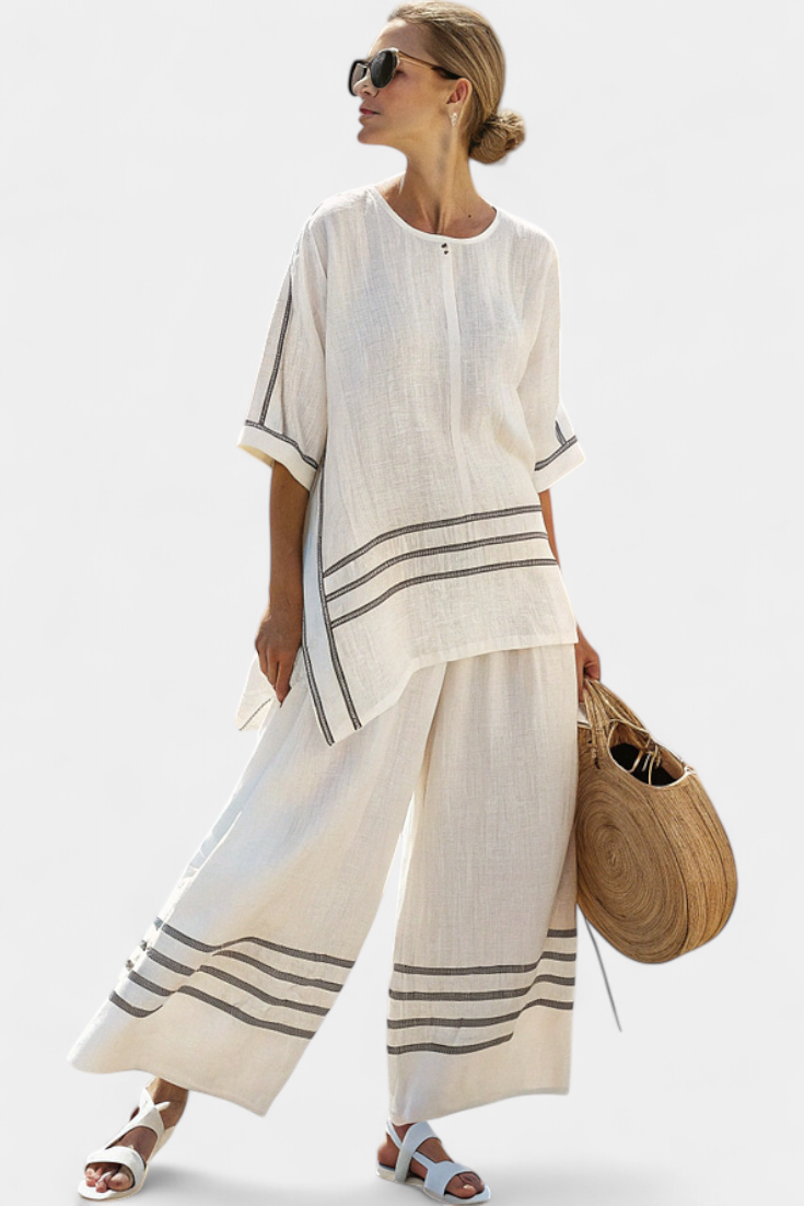Rina – Sophisticated Asymmetric Striped Top and Bold Pants
