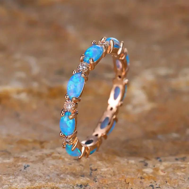 Dixie – Gold Ring with Blue Opal Elements