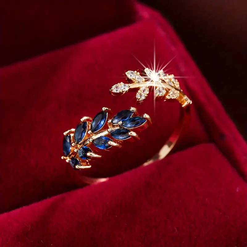 Barbara – Open Gold Ring with Blue Leaves and Zirconia