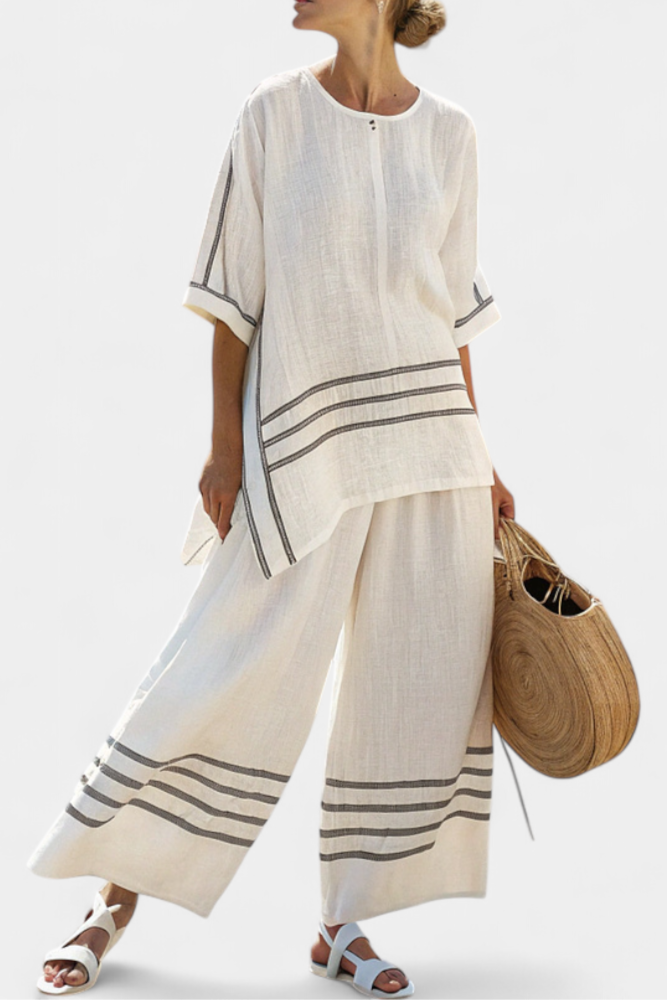 Rina – Sophisticated Asymmetric Striped Top and Bold Pants