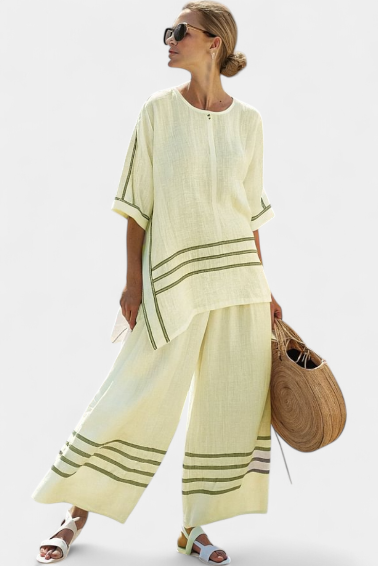 Rina – Sophisticated Asymmetric Striped Top and Bold Pants